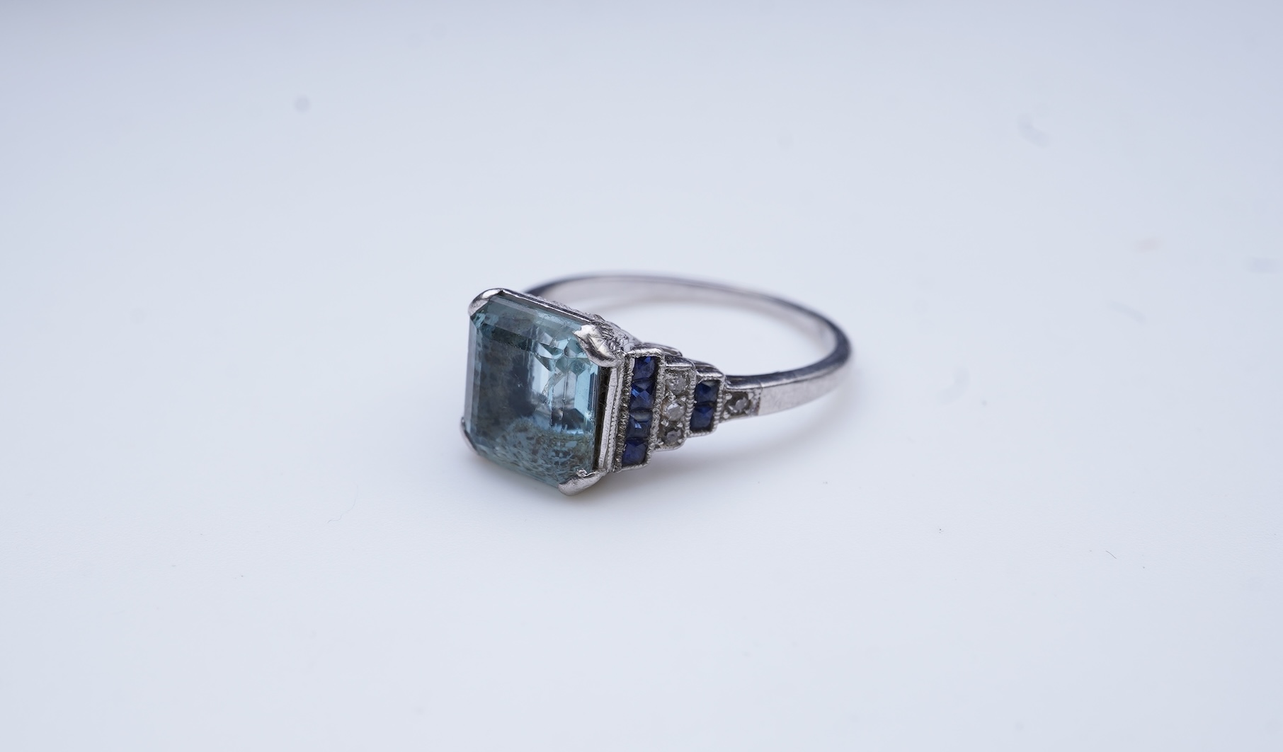 An aquamarine, sapphire and diamond ring